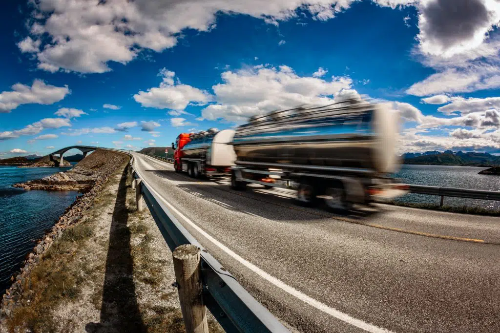 Truck rushes down the highway in the background Atlantic Ocean R